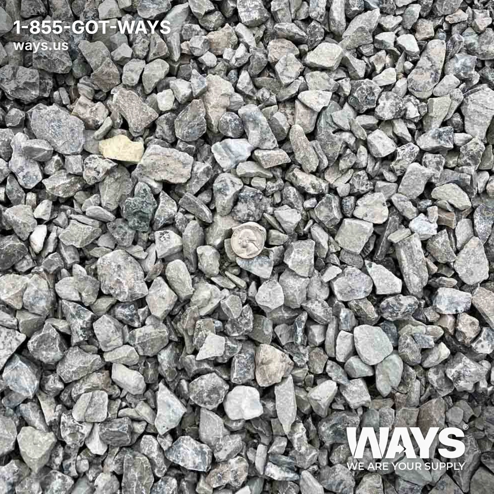 Angular crushed limestone gravel with a quarter coin for size reference