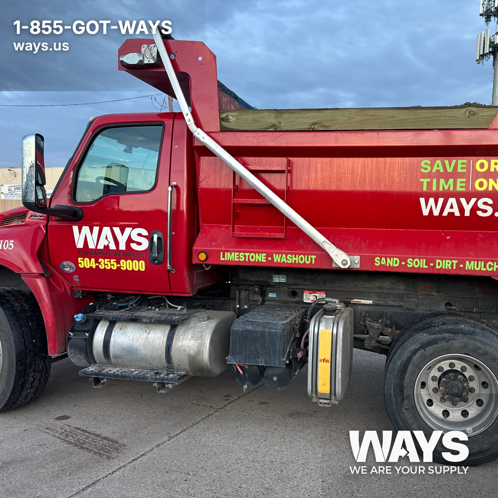 WAYS Materials red dump truck ready for bulk material delivery in New Orleans Metro