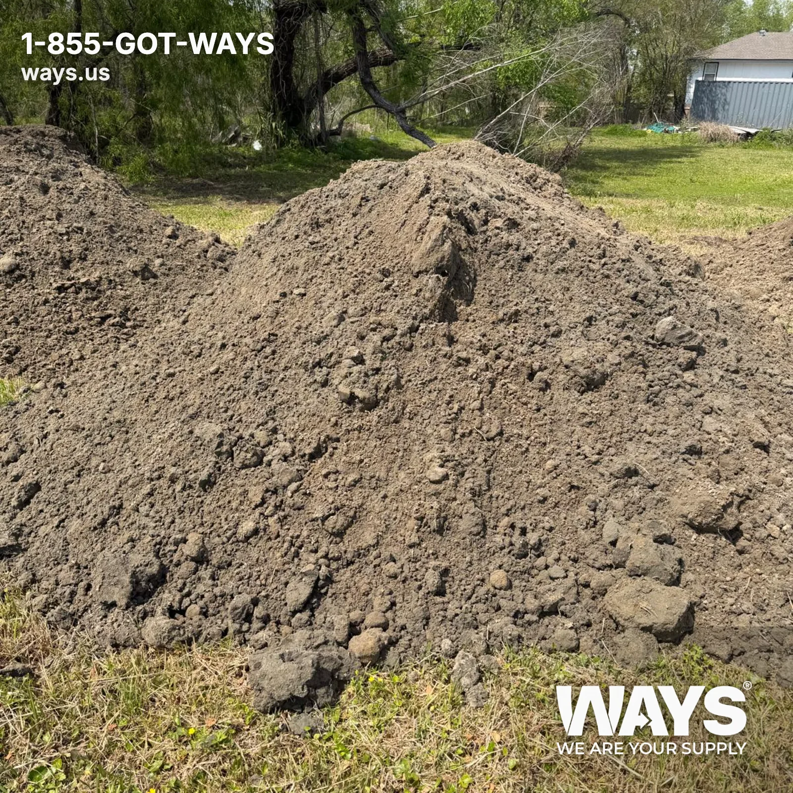 Large pile of spillway dirt delivered to a New Orleans residential yard for grading