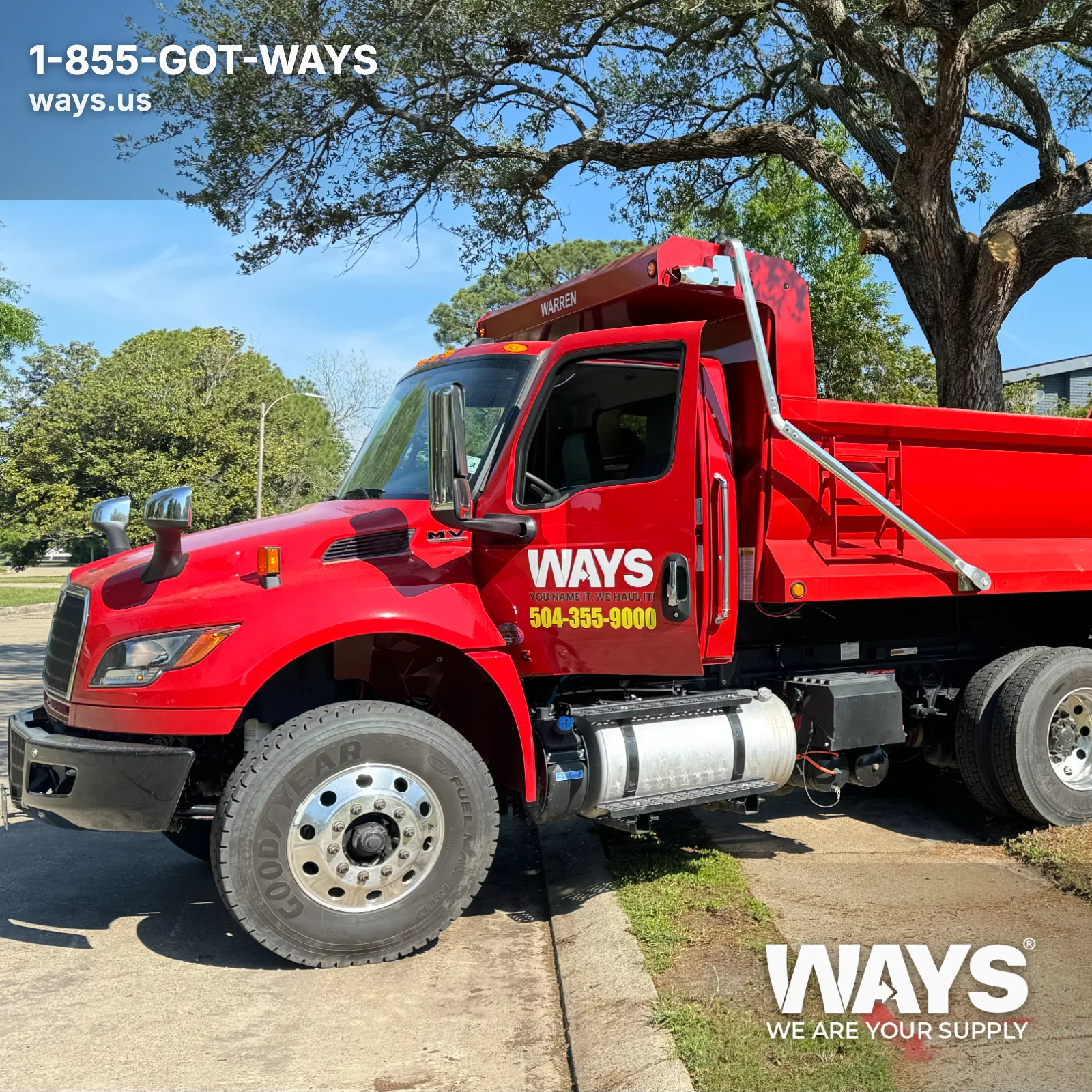 WAYS Materials red dump truck ready for bulk dirt delivery in New Orleans