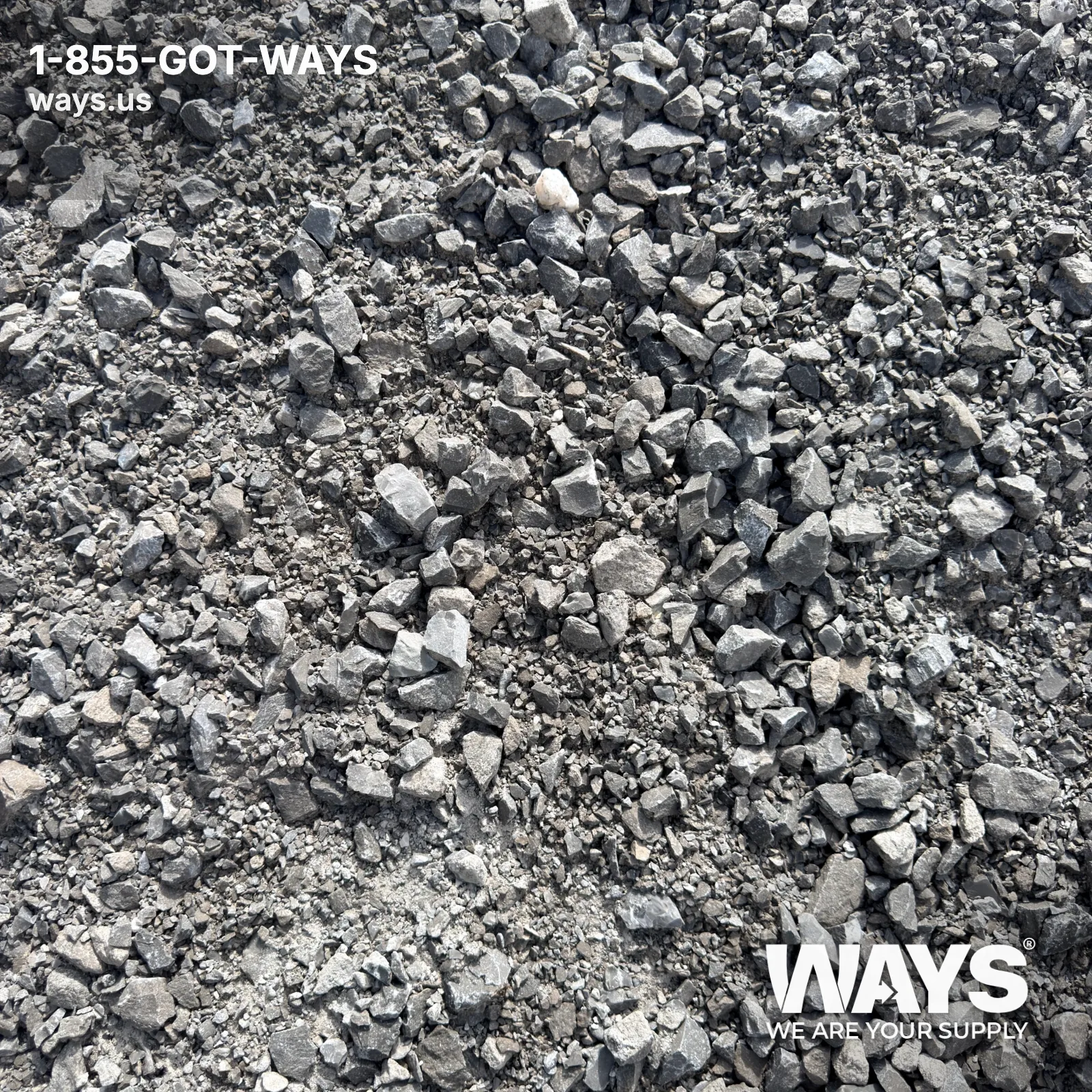 Close-up of #610 limestone in hand showing fine gray dust mixed with 3/4 inch angular chips