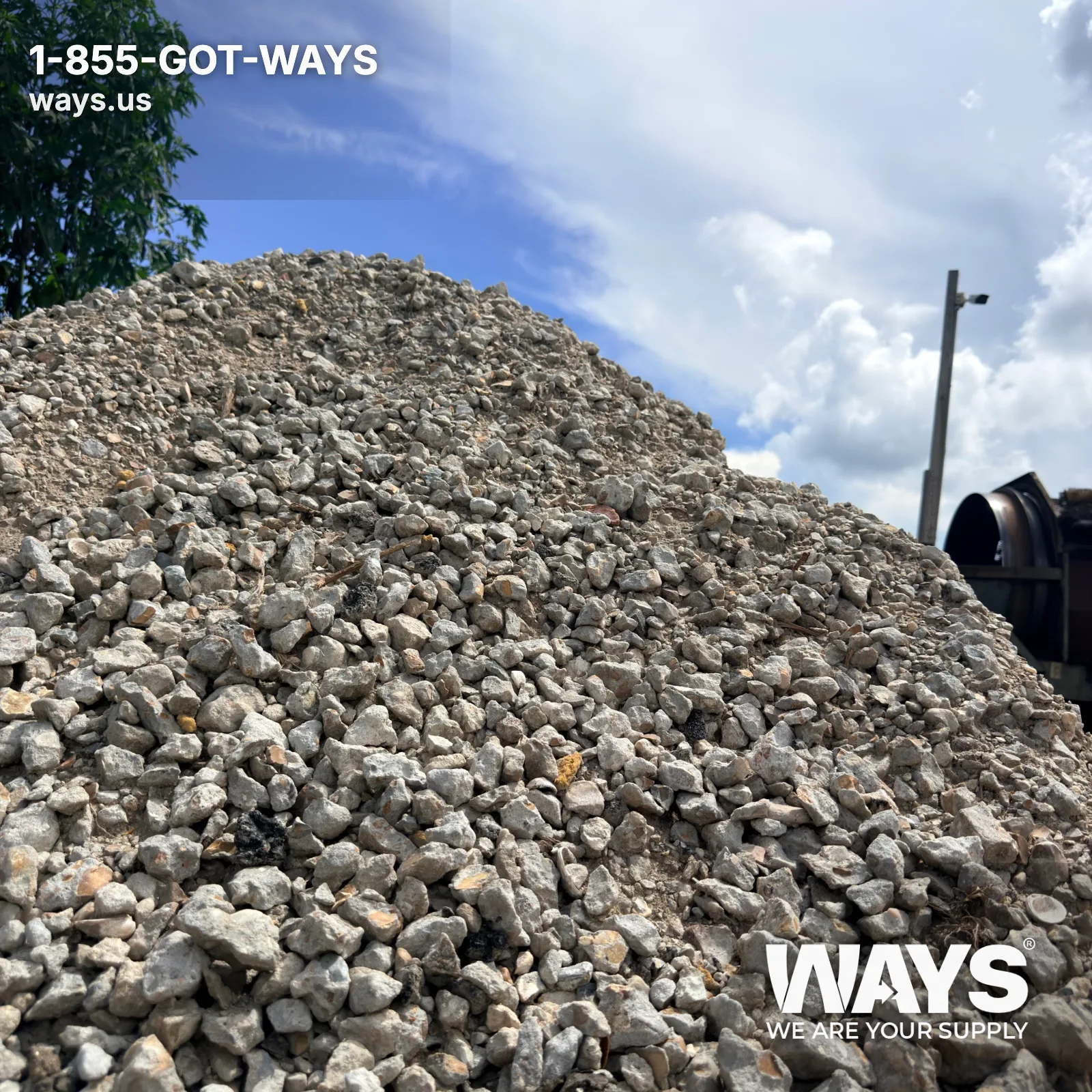 Close-up of crushed concrete recycled aggregate pile with mixed gray stone and fines