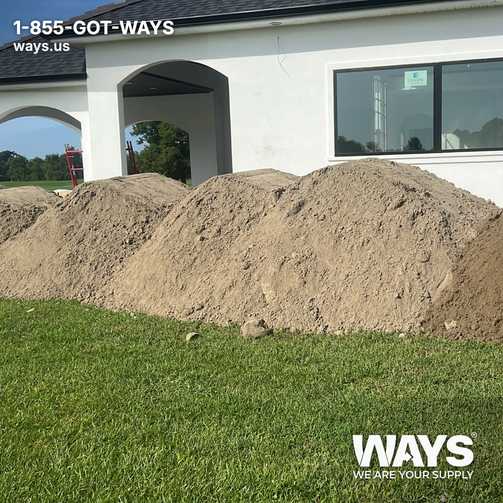 Large bulk pile of dredged river sand delivered to a residential yard in New Orleans