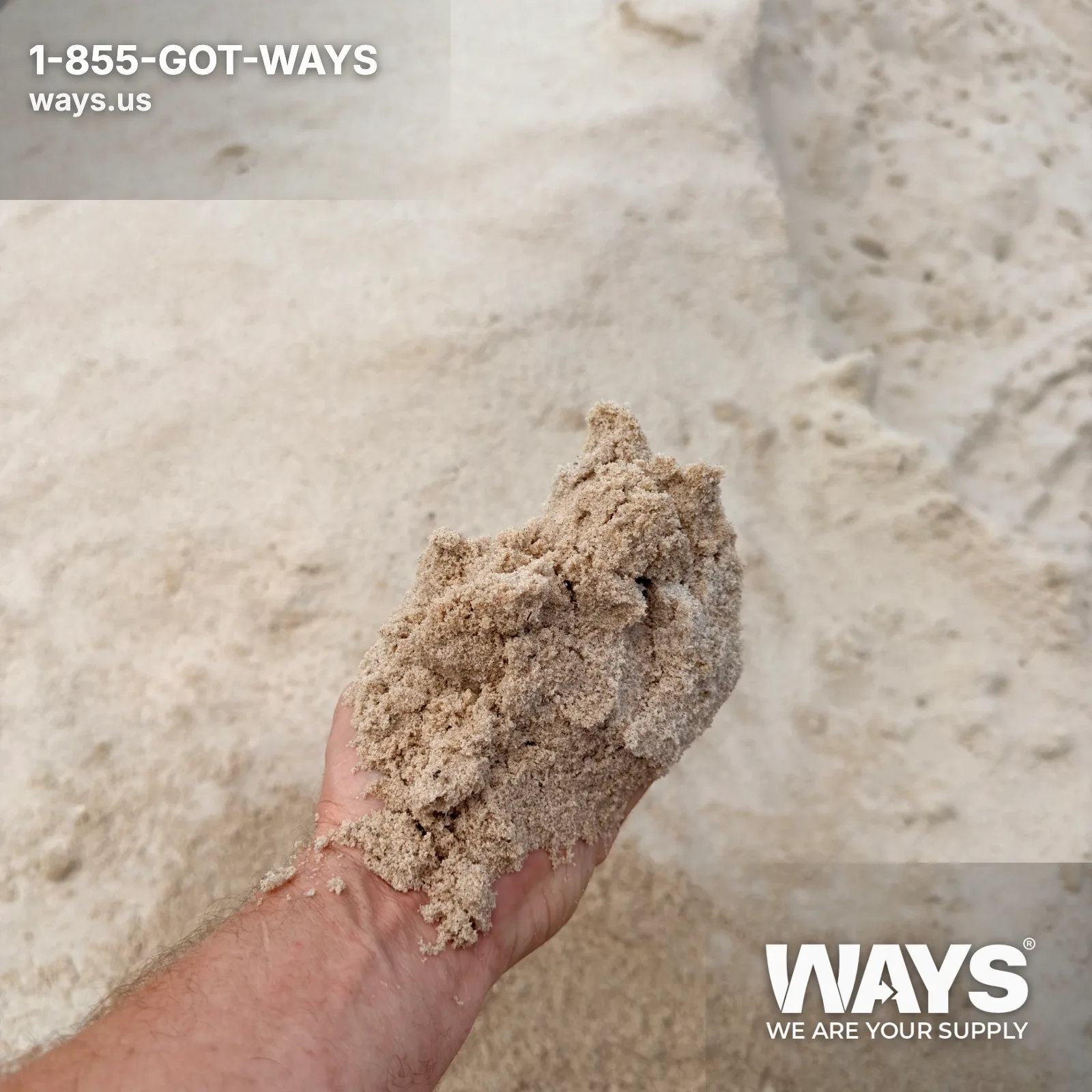 Close-up of fine-grained tan masonry sand spread flat for inspection